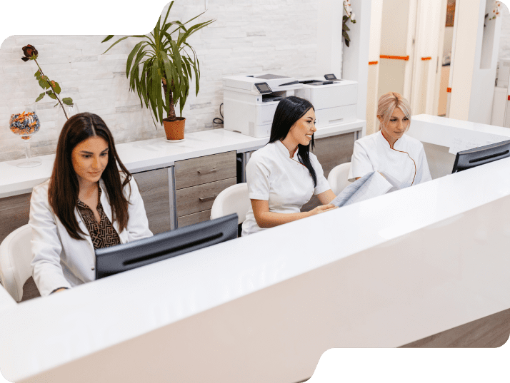 Colleagues at a clinic on computers