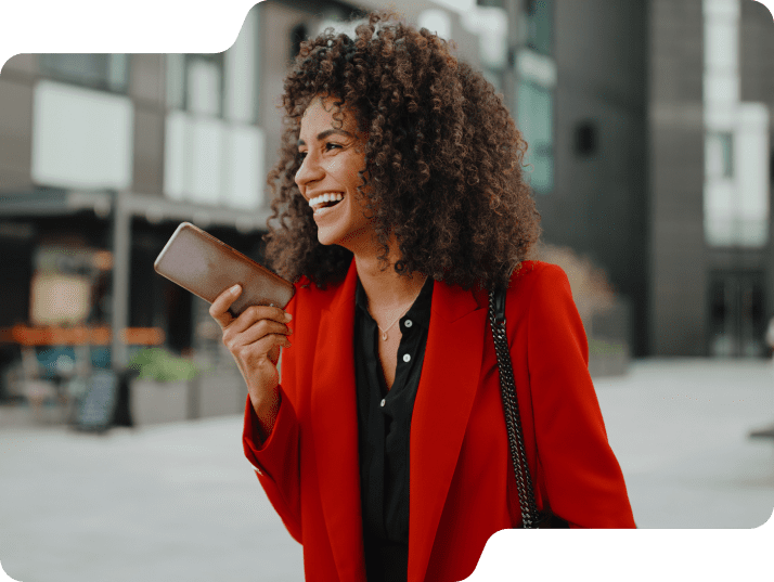 Woman holding smartphone smiling