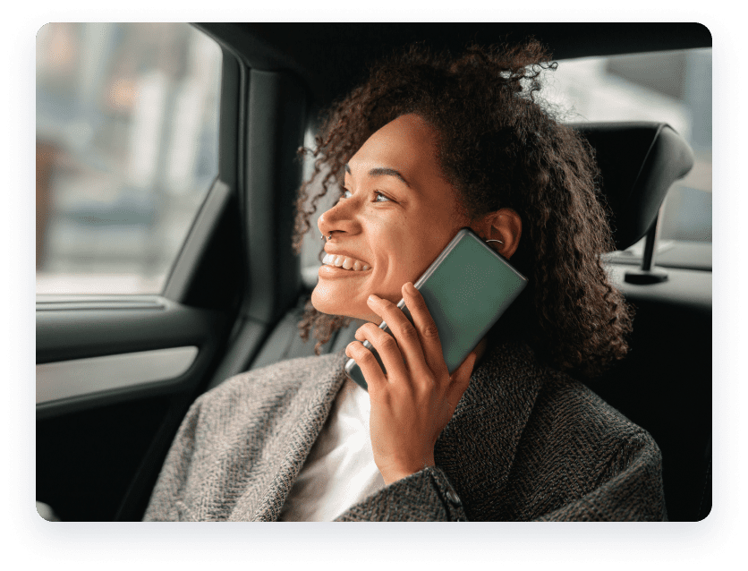 Woman smiling on smartphone.