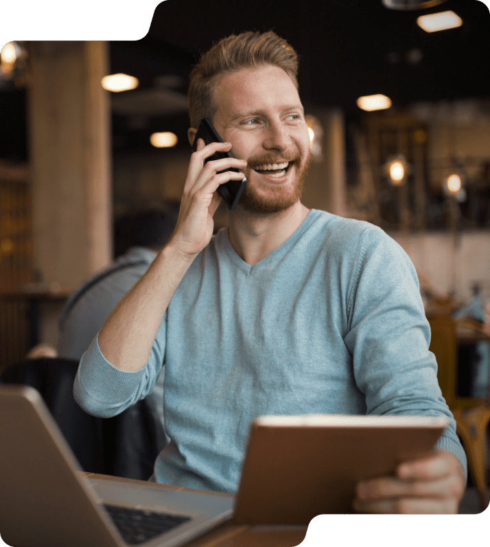 Man smiling on tablet and phone