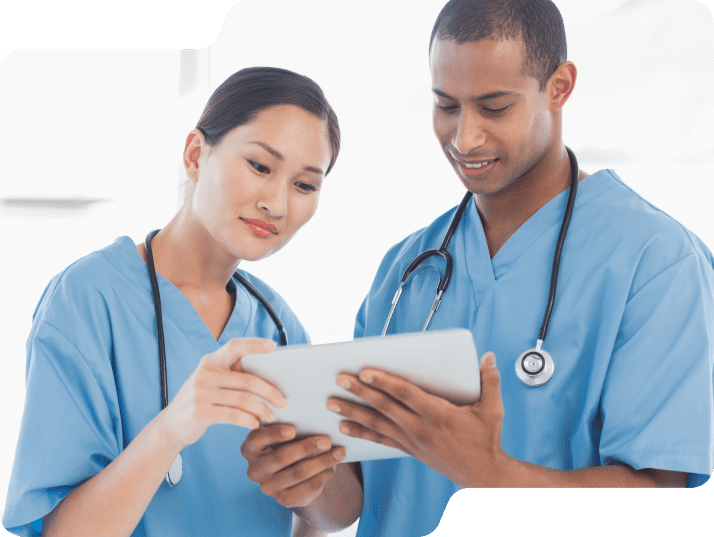Medical colleagues looking at a tablet.